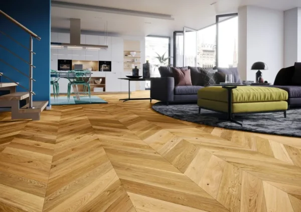 Spacious modern living room featuring stylish chevron wooden flooring and contemporary furniture