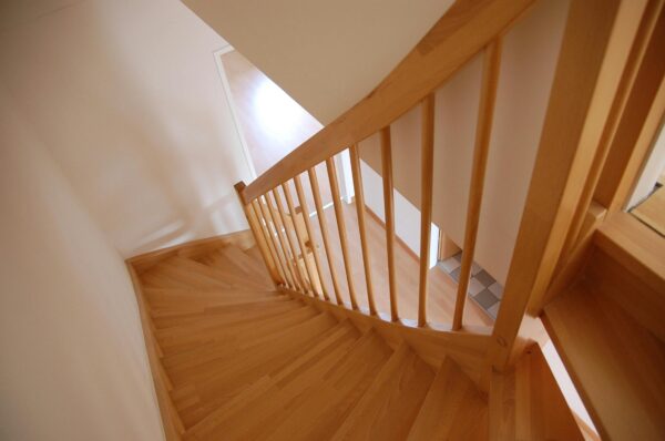 View of a spiral wooden staircase from above